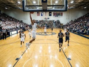 NCAA compliant home white and away dark basketball uniforms in a game.
